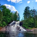 Waterfall, trees and blue sky in the Township of South Algonquin