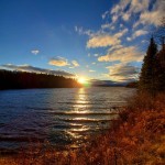 Dark blue sky and sunset over a lake