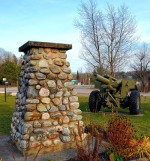 Stone war memorial and cannon in Galeairy Lake Memorial Park and Trail, Whitney