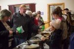 A group of people at a community supper in the Township of South Algonquin